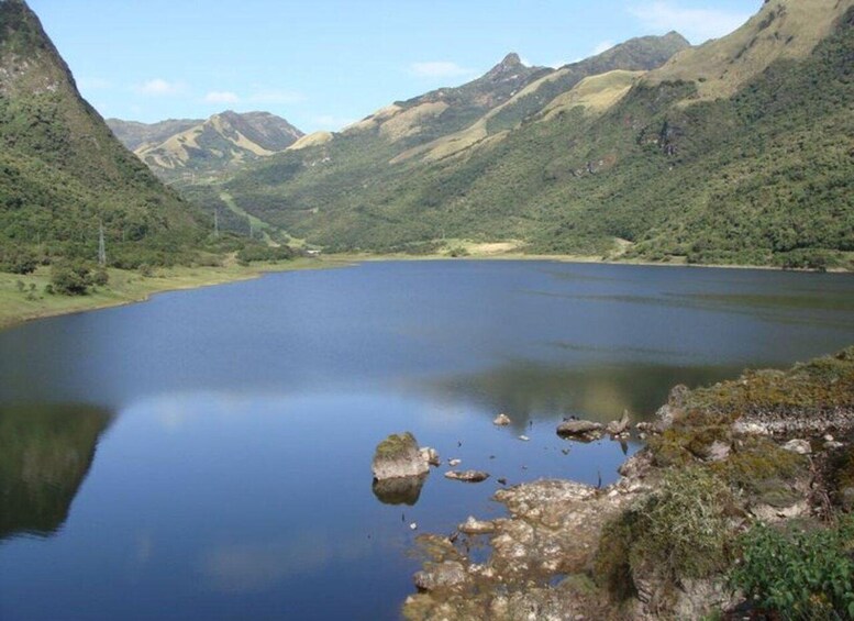 A calm lake surrounded by mountains. 3