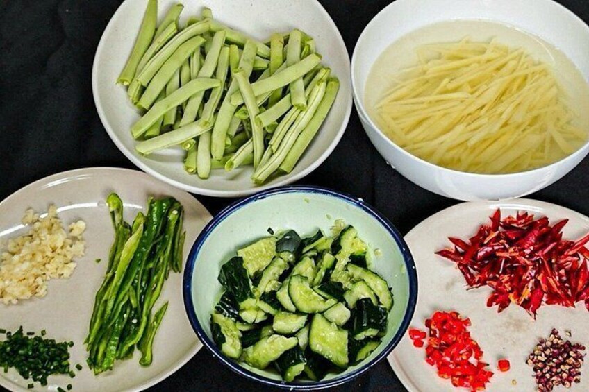 Various vegetables and spices on plates. 5
