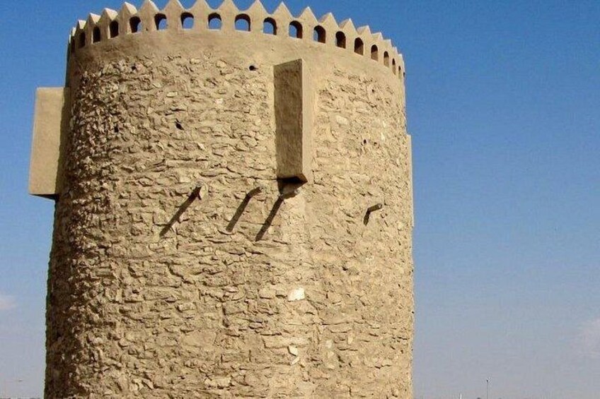 A stone tower with crenellations and a narrow vertical window. 4