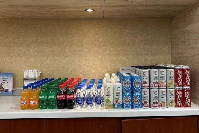A variety of bottled beverages on a shelf. 4