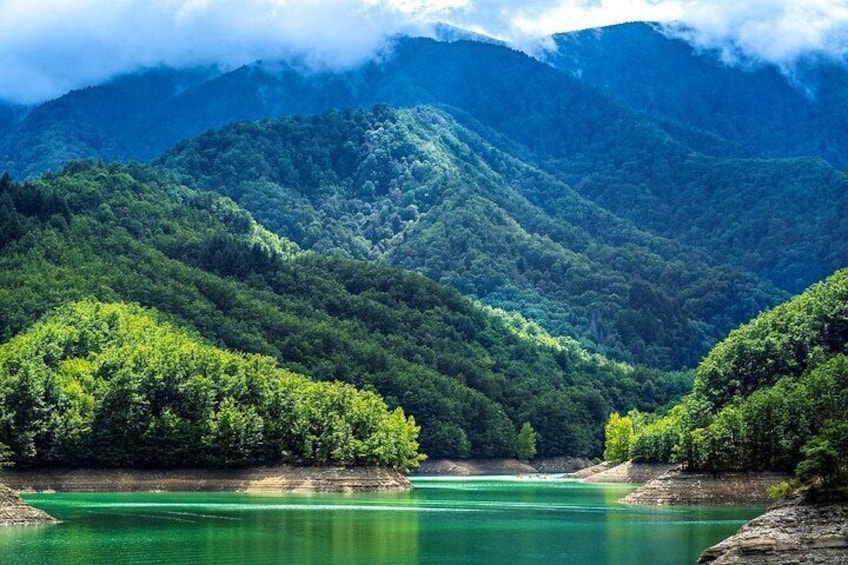 A mountain landscape with a river. 1