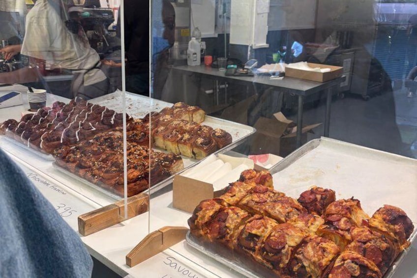 A bakery display with various baked goods. 4