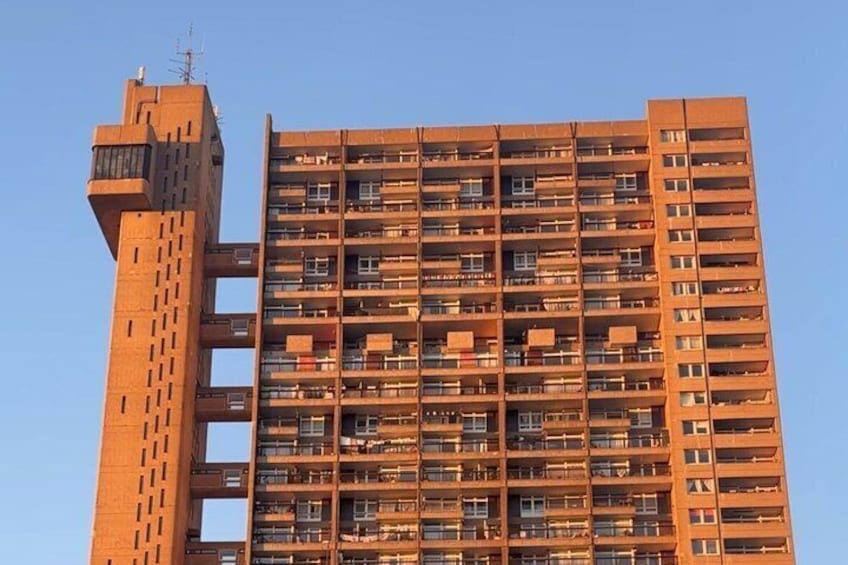 A high-rise building with multiple balconies and a unique tower structure. 5