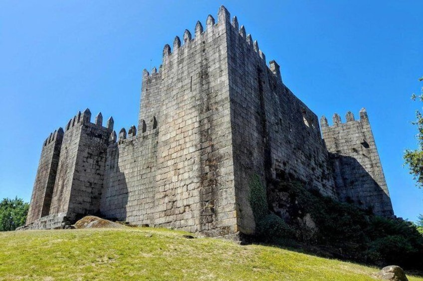 A large stone castle with multiple towers and battlements. 4