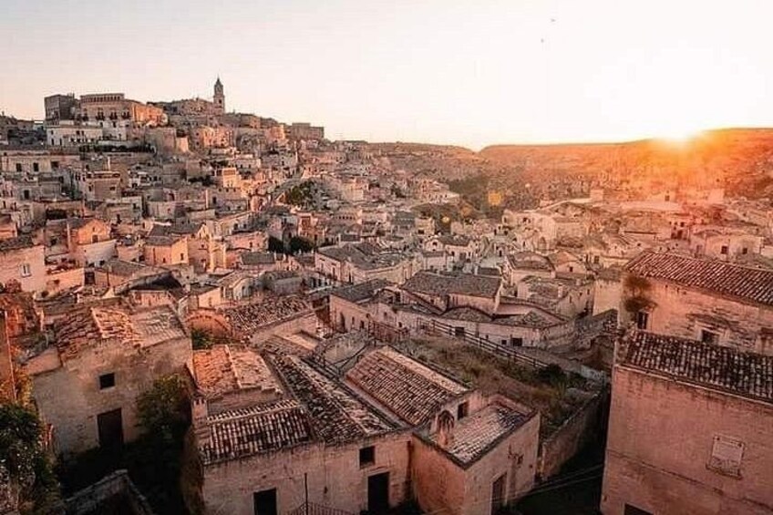 A cityscape with a hilltop building and densely packed buildings. 5