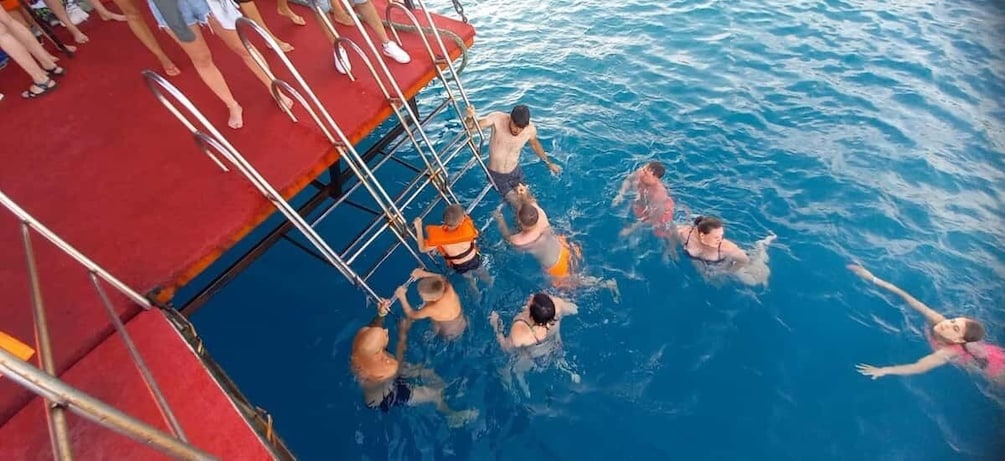 People swimming in a pool on a boat. 5