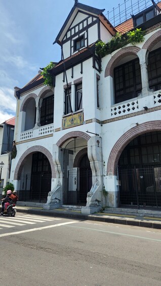A historic building with arched windows and a tiled facade. 3