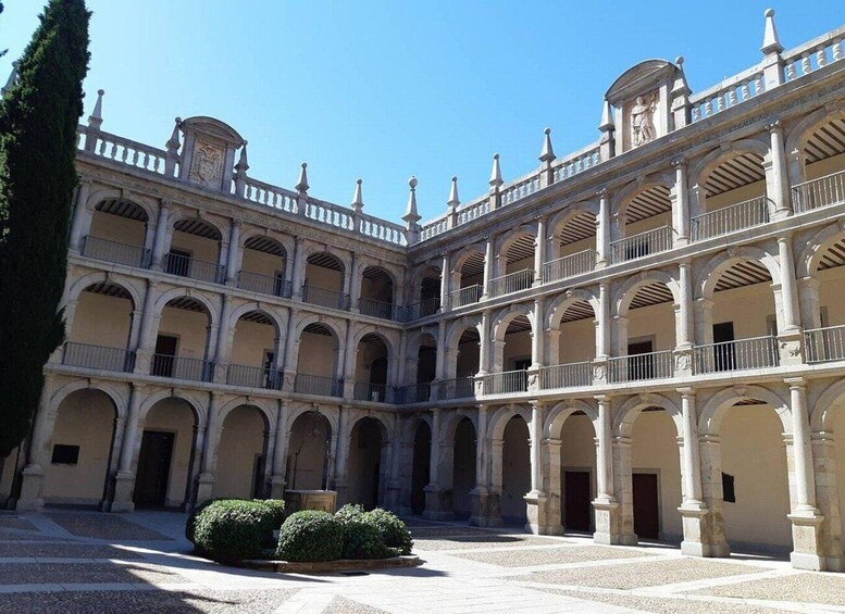 A courtyard with a central fountain, surrounded by classical architecture with arches and columns. 2