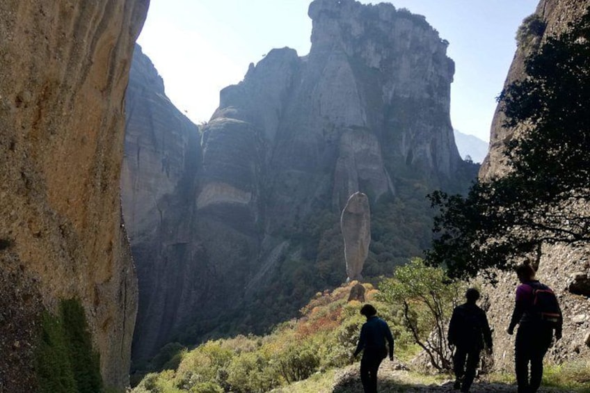 A canyon with rock formations and hikers. 2
