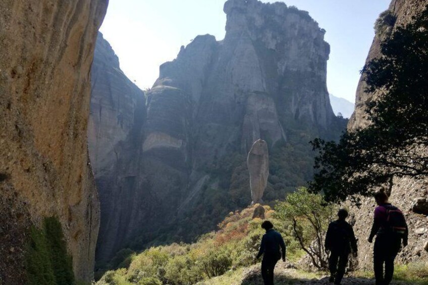 A canyon with rock formations and hikers. 2