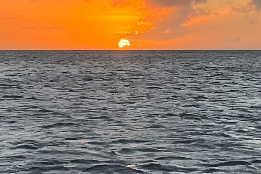 A sunset over the ocean with waves. 4