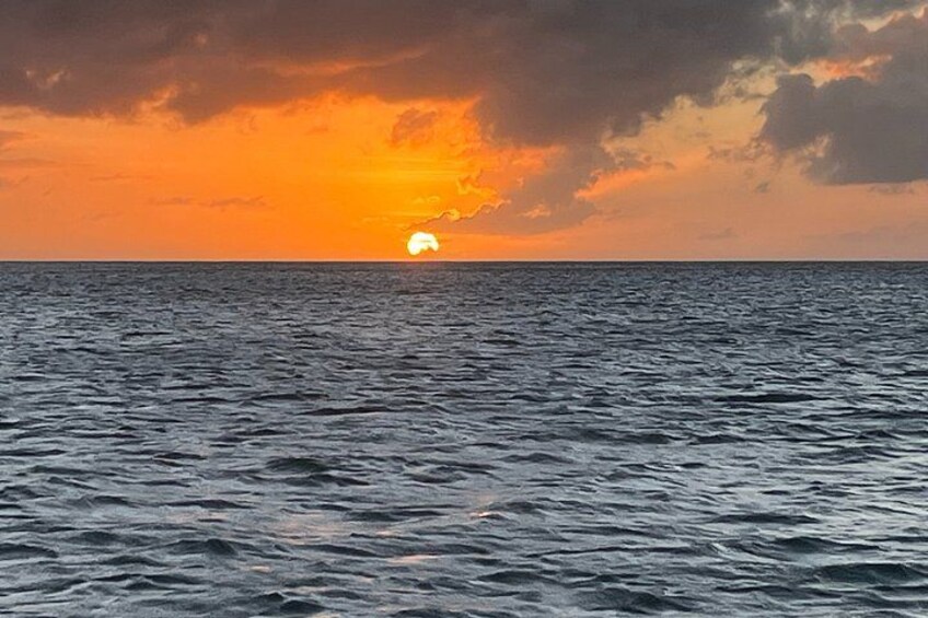 A sunset over the ocean with waves. 5