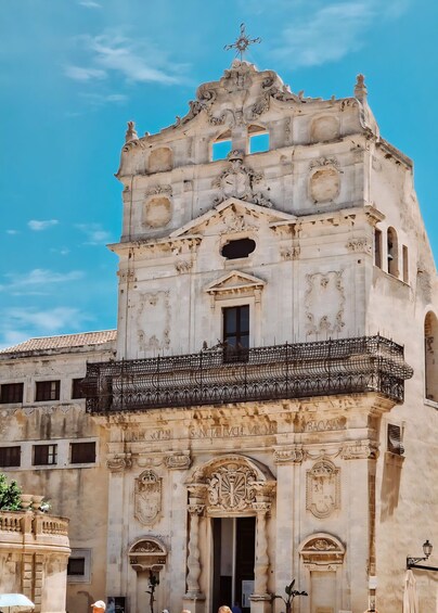 A historic church with ornate architecture and a weathered facade. 4