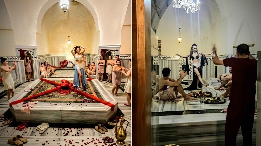 A room with a central platform, people around it, and a chandelier. 2