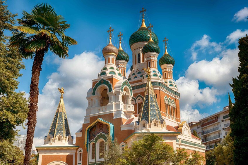 A church with multiple domes and spires, surrounded by trees and buildings. 5