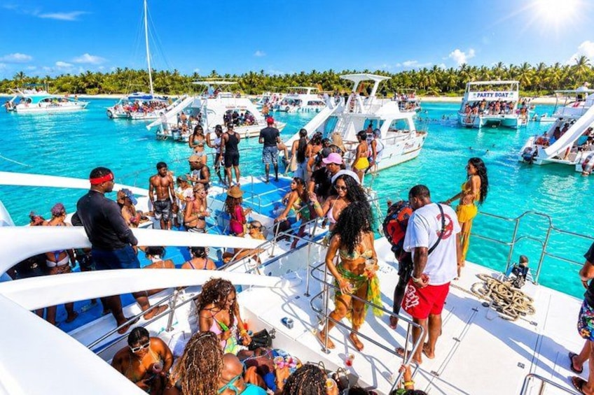 A crowded marina with multiple boats and people. 1