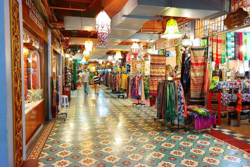 A bustling market with colorful textiles and handicrafts. 5
