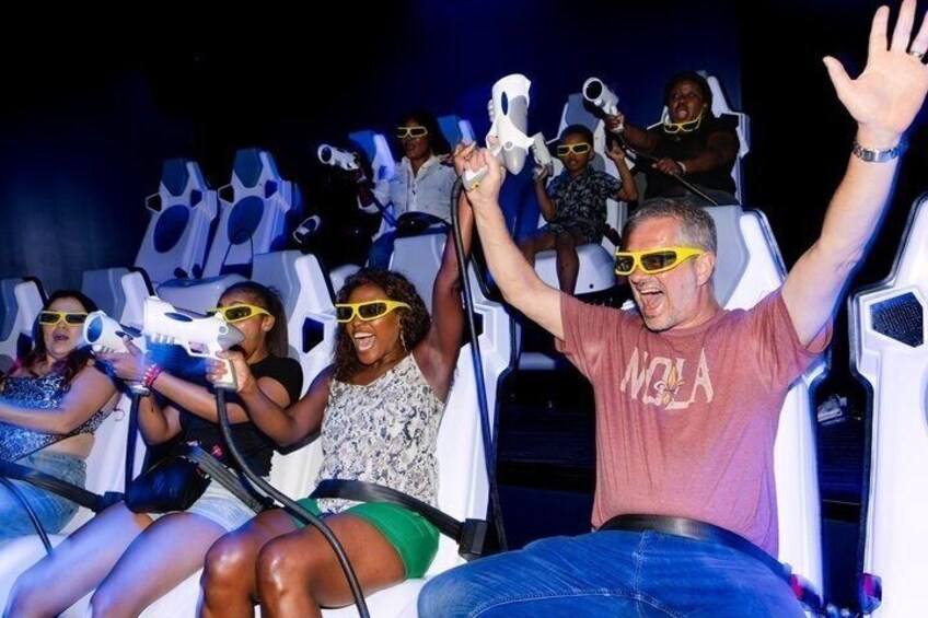 People on a ride with white seats and yellow sunglasses. 4