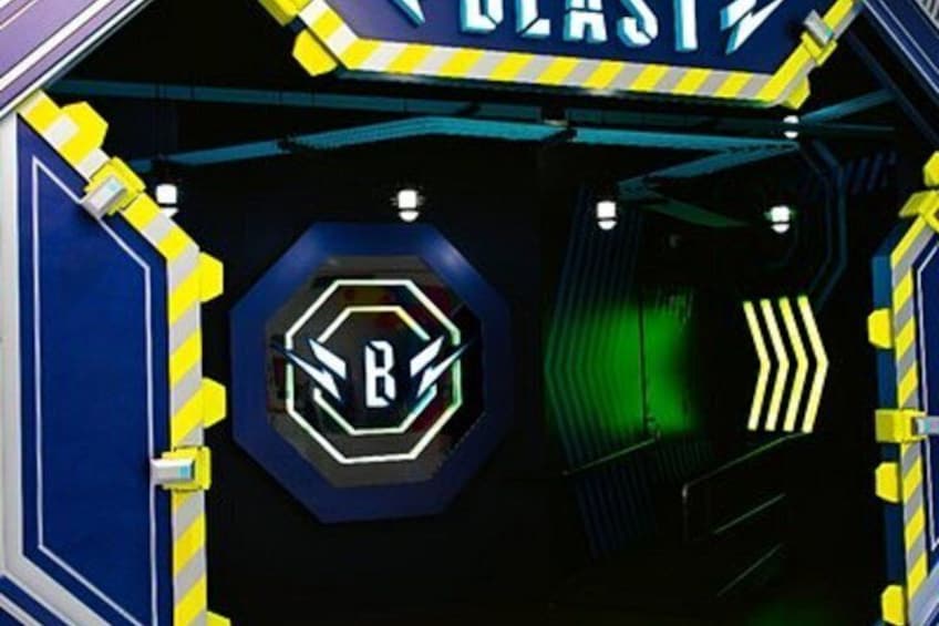 A futuristic tunnel with a hexagonal sign featuring a stylized 'B' and a neon 'BLAST' sign above. 1