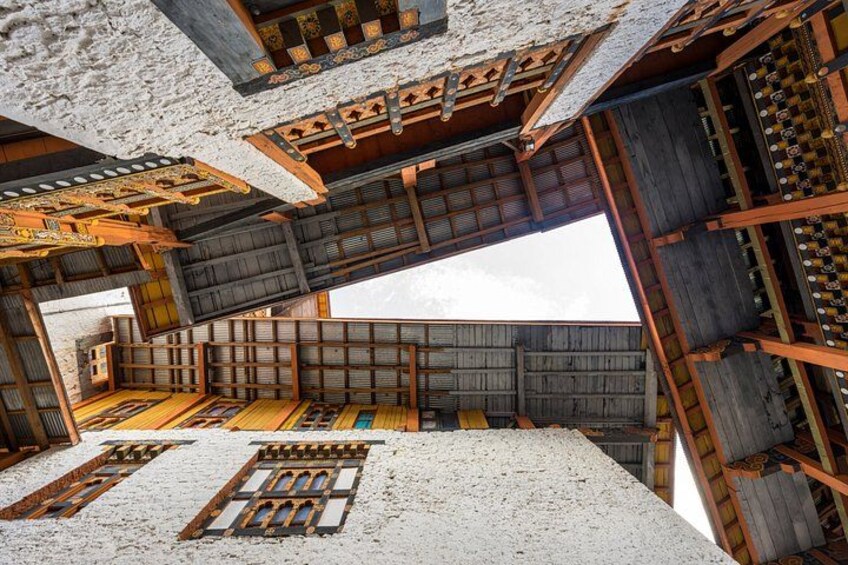 A traditional wooden structure with intricate designs and a sloped roof. 4