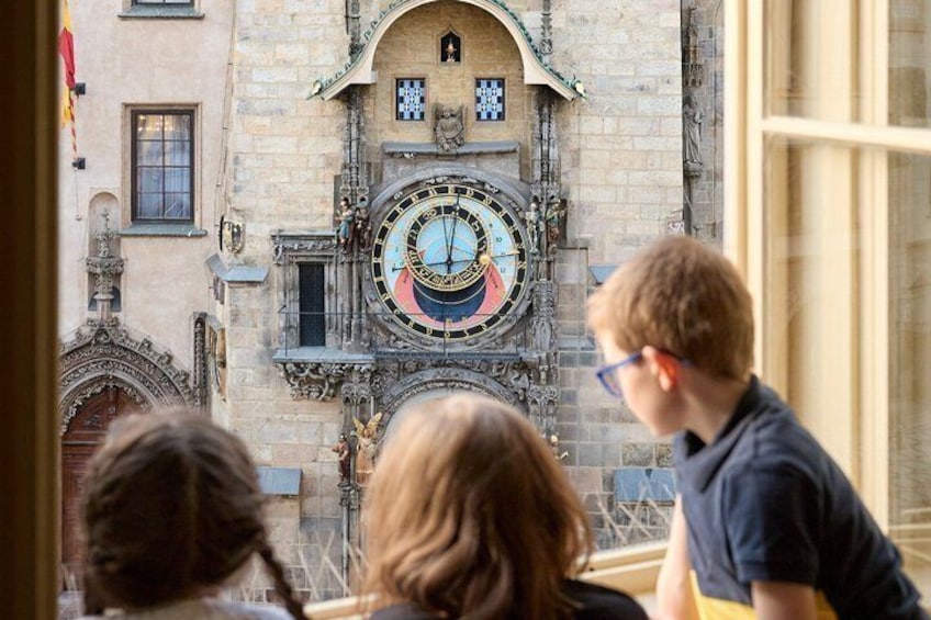A historic building with a large, ornate clock tower and intricate architectural details. 2