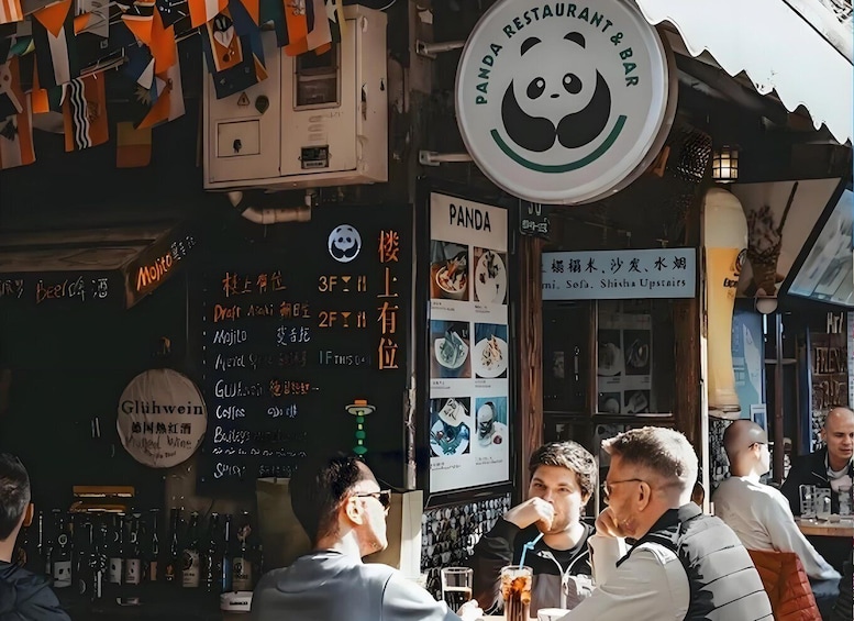 A restaurant with a panda logo and a sign for 'Panda Restaurant & Bar'. 5