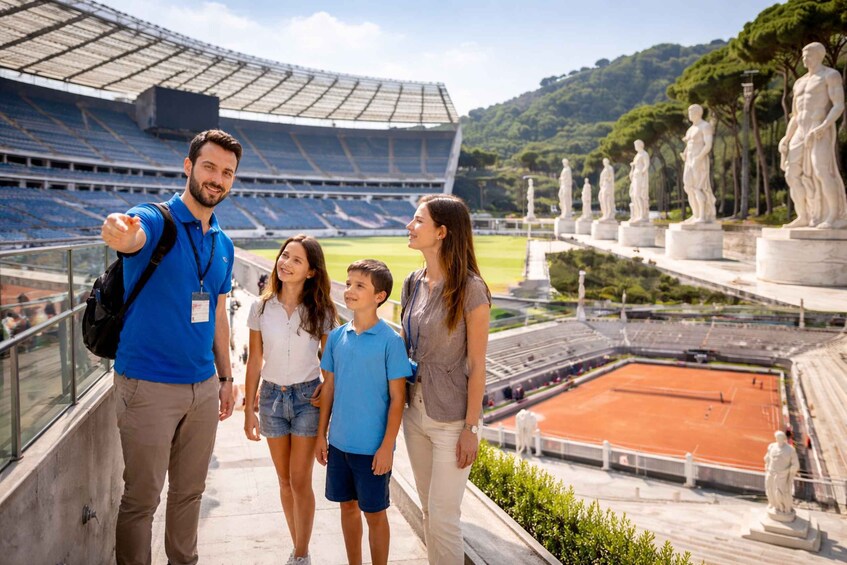A stadium with empty stands, a tennis court, and classical statues. 3