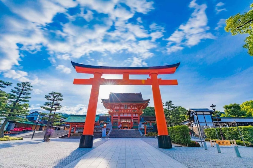 A traditional Japanese torii gate with a pagoda in the background. 2
