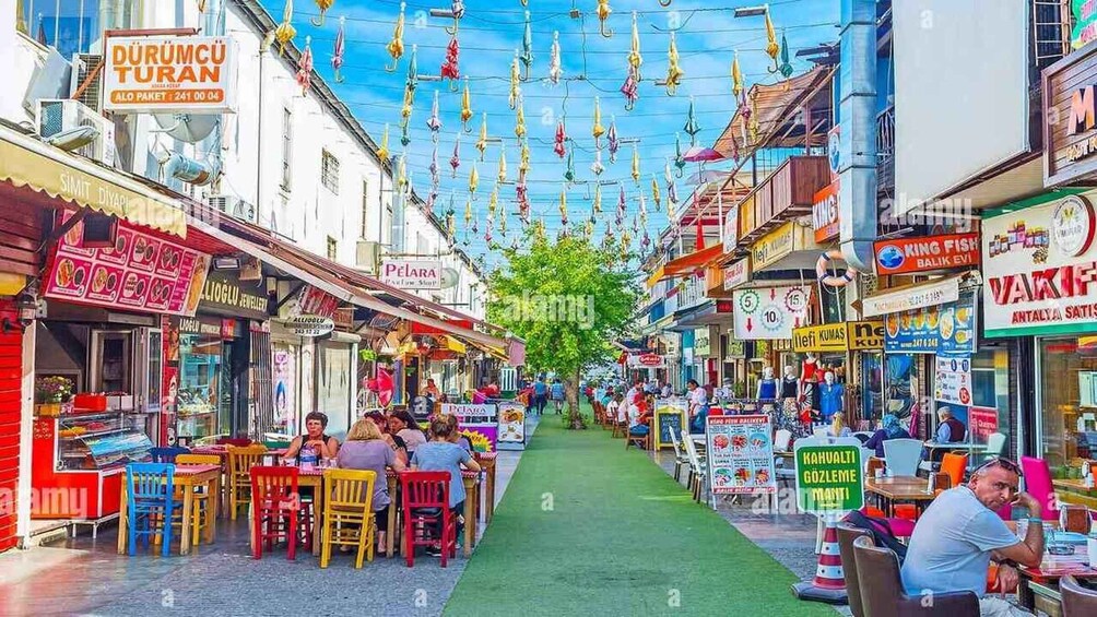 A bustling street market with colorful shops and hanging decorations. 4