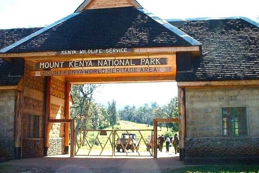 The entrance to Mount Kenya National Park with a sign for the Kenya Wildlife Service. 4