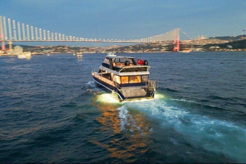 A boat on water with a bridge in the background. 5