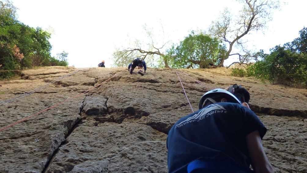 A rocky climbing route with climbers ascending. 2