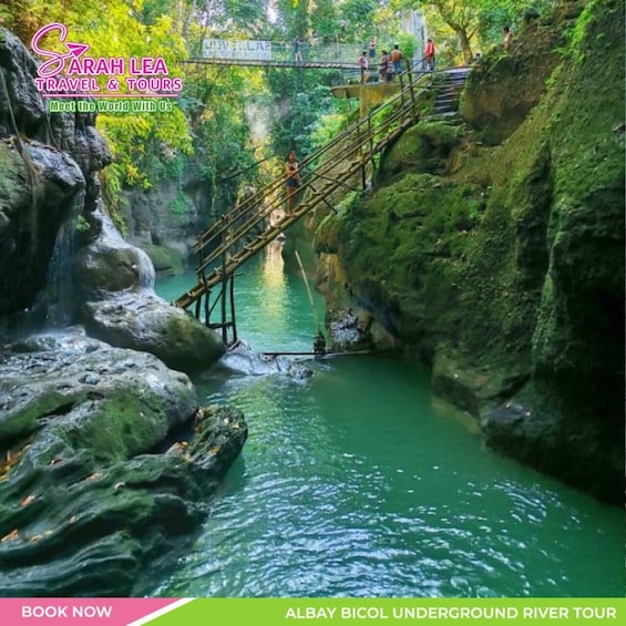 A river with a wooden bridge and a waterfall. 1