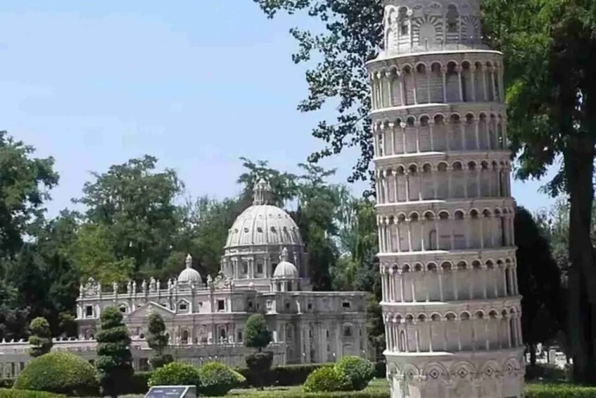 A large domed building with a tower-like structure nearby. 2