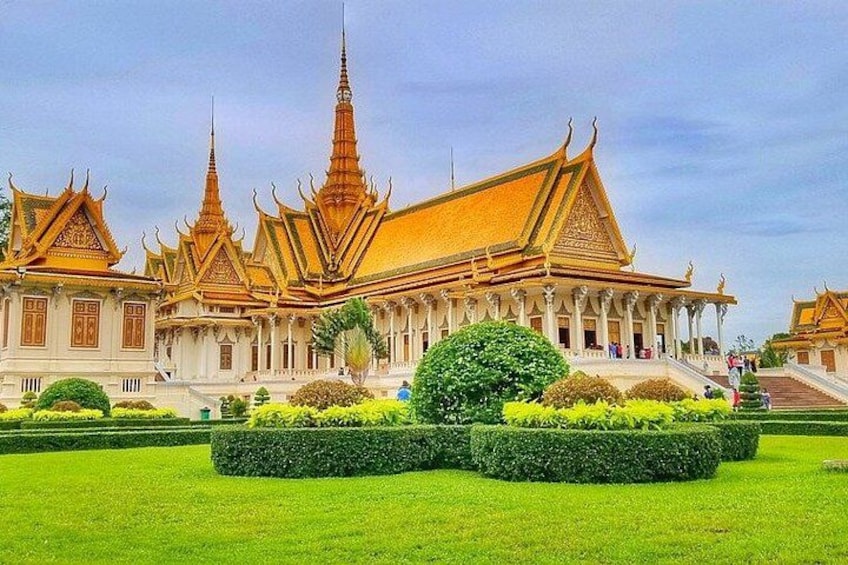 A traditional Thai temple with ornate architecture and well-maintained gardens. 3