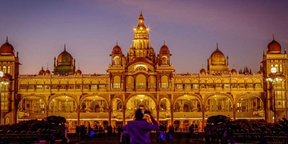 A grand, illuminated building with multiple domes and arches, likely a historical or cultural landmark. 4