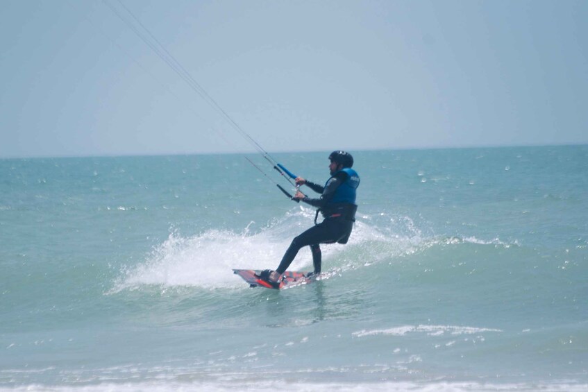 A person windsurfing on the water. 1