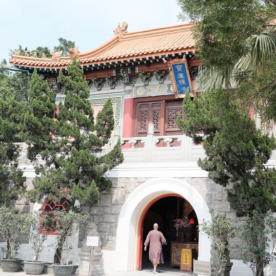 A traditional Chinese building with ornate architecture, including a tiled roof and decorative columns. 3