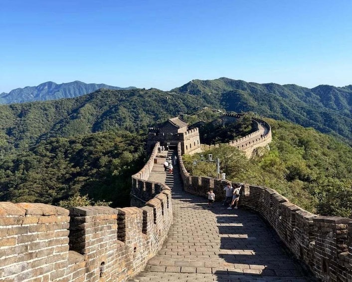 The Great Wall of China winding through a mountainous landscape. 4