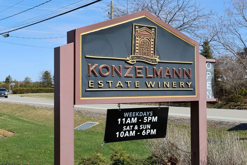 A sign for the Konzelmann Estate Winery with operating hours listed. 5