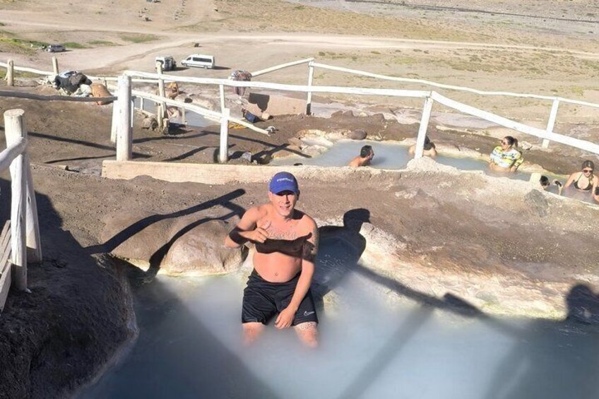 A person in a steam bath with others around. 4