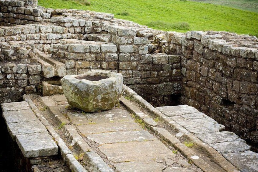 Ancient stone ruins with a large stone structure in the foreground. 3