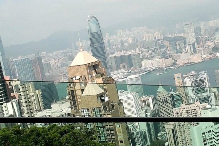 A cityscape with high-rise buildings, a prominent skyscraper, and a river. 3