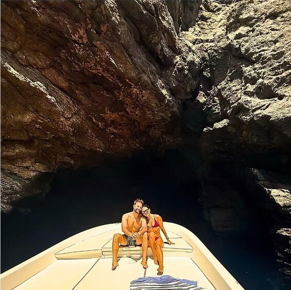 A couple on a boat in a rocky canyon. 5