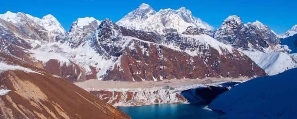 Snow-capped mountains, a glacier, and a clear blue sky. 1