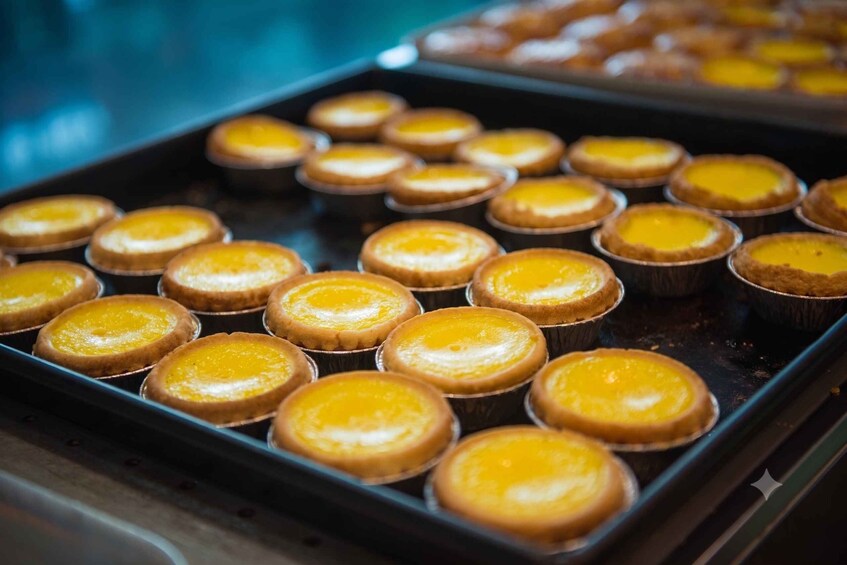 A tray of freshly baked custard tarts. 5