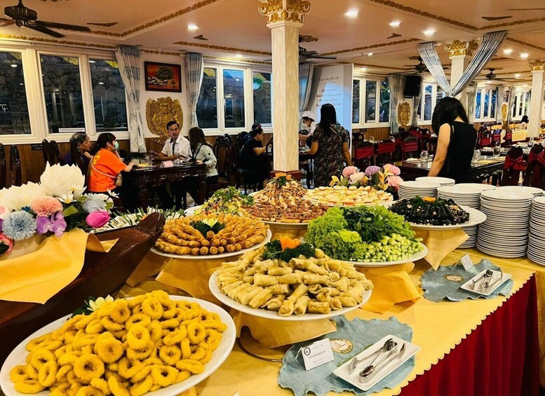 A buffet with various food items and a decorative ceiling. 2