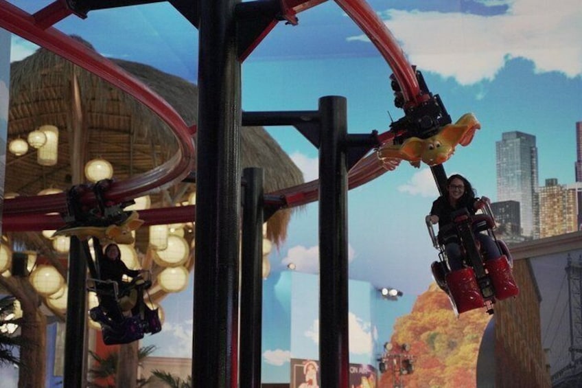 A roller coaster with a cityscape background. 4