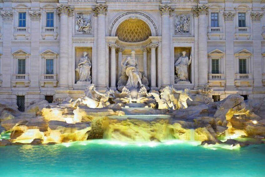 The Trevi Fountain with sculptures and a large circular basin. 4