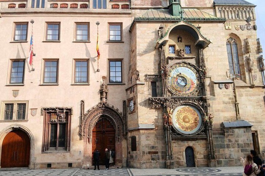 A historic building with ornate architecture, including a large clock and a decorative entrance. 3